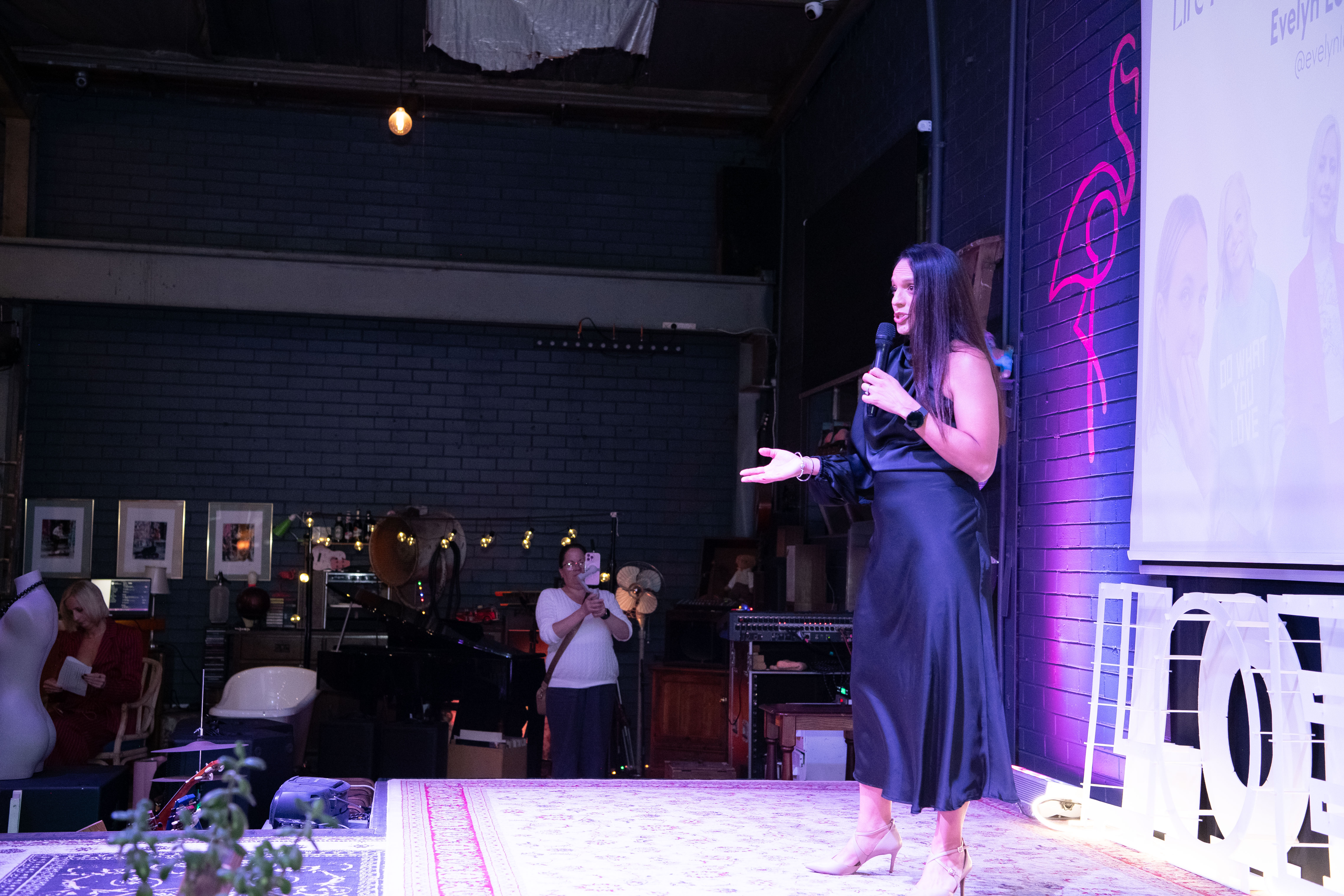 Evelyn speaking on stage